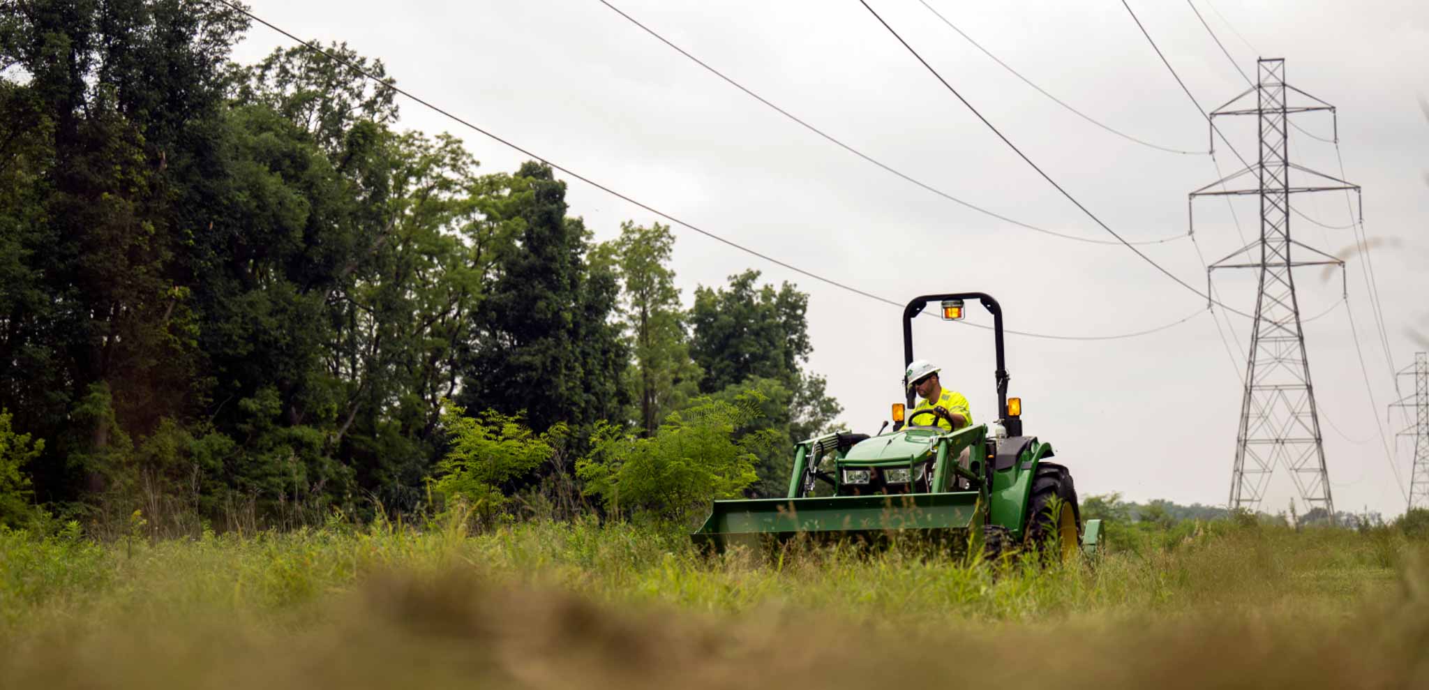 An industrial mower clearing brush