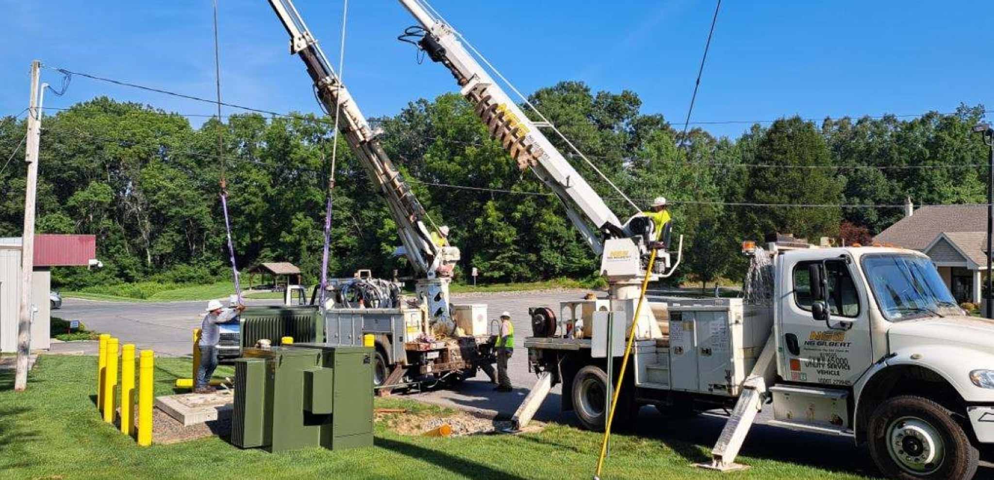 Two trucks servicing a power line