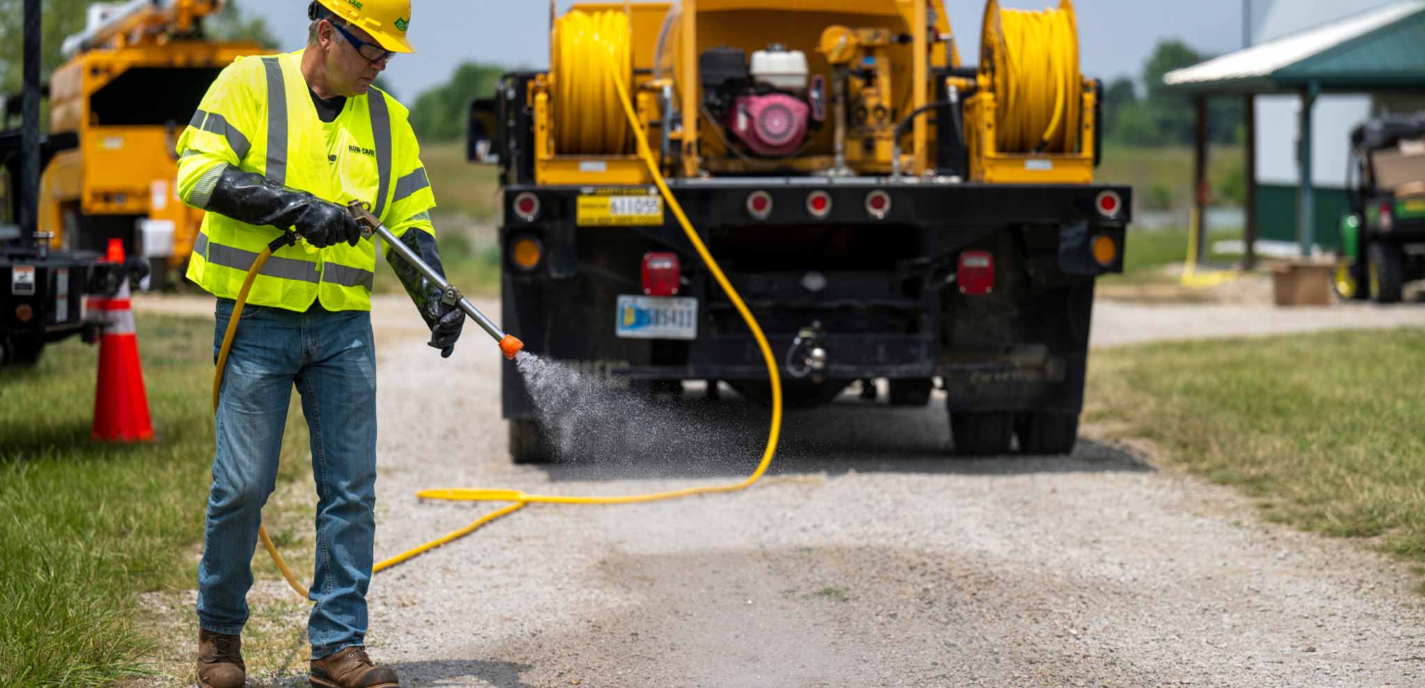 A worker spraying Herbicide