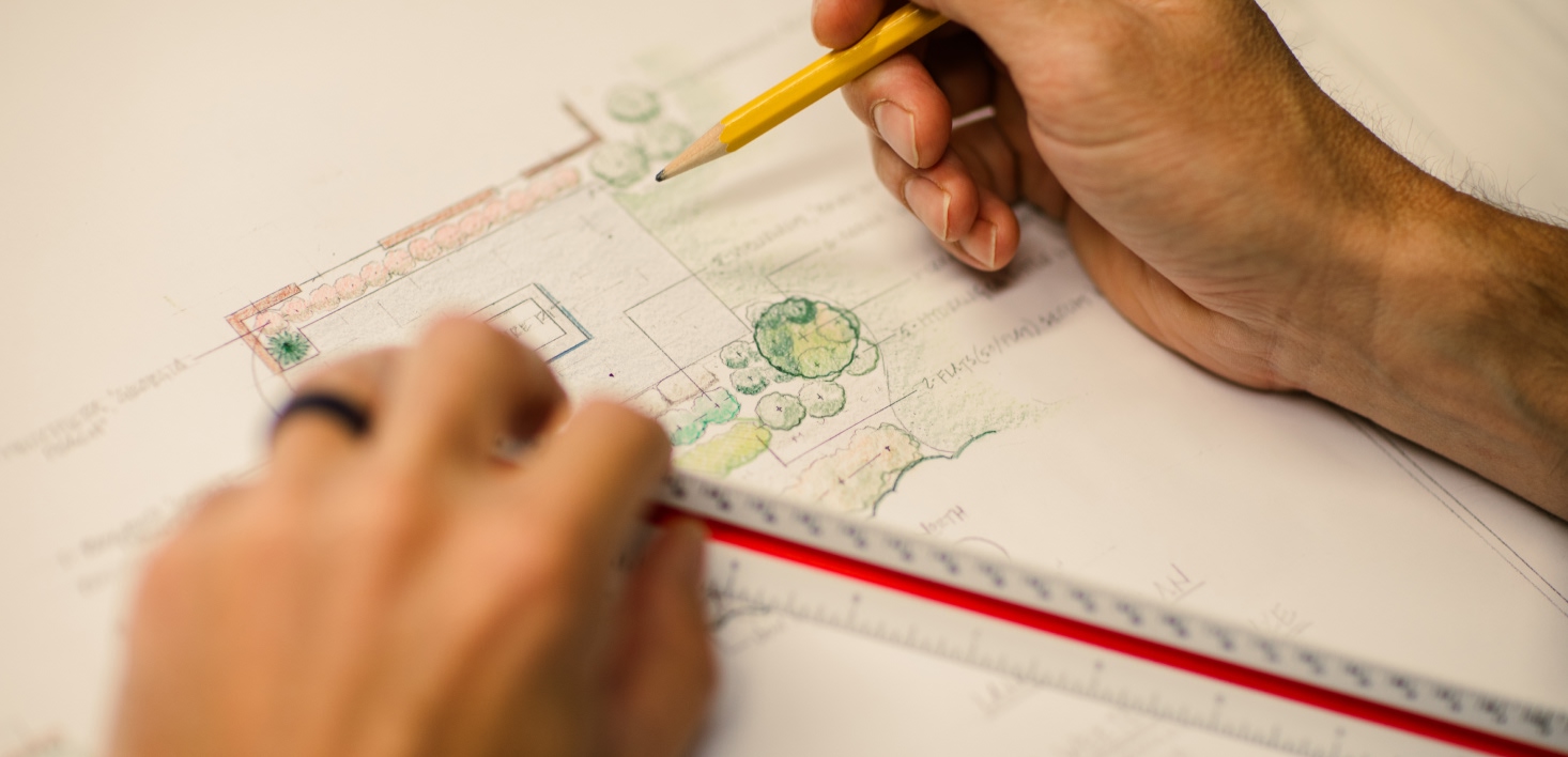 A landscape architect drawing a plan